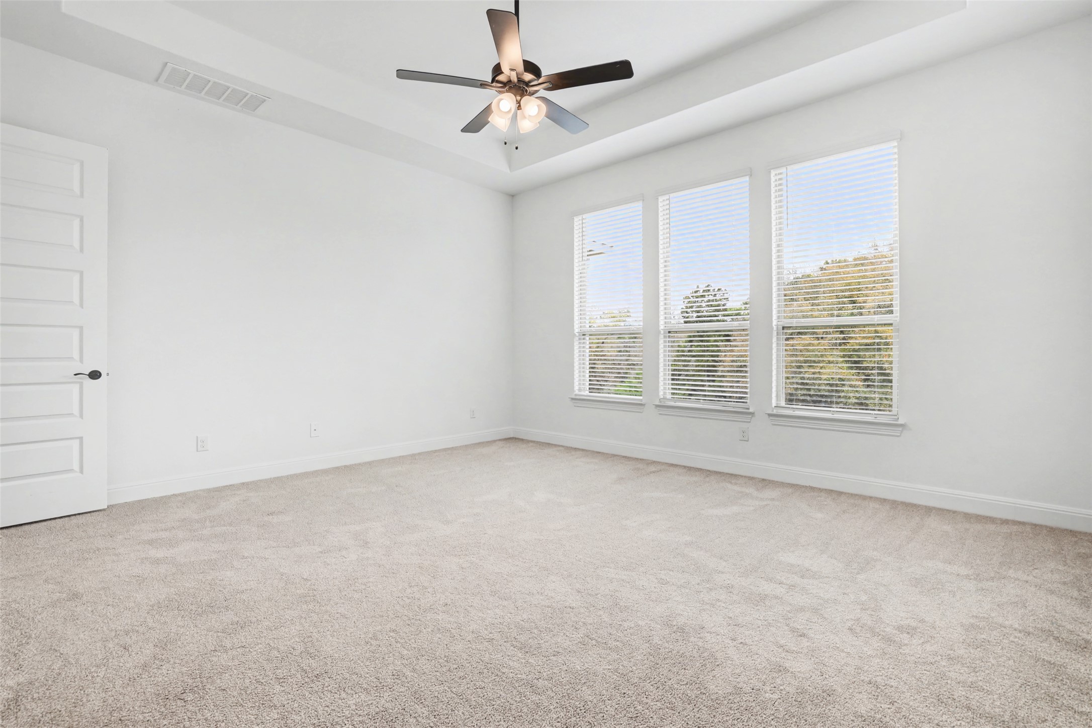 104 Rocky River Road Georgetown, TX 78628 - Photo 18 of 39 an empty room with windows and chandelier fan