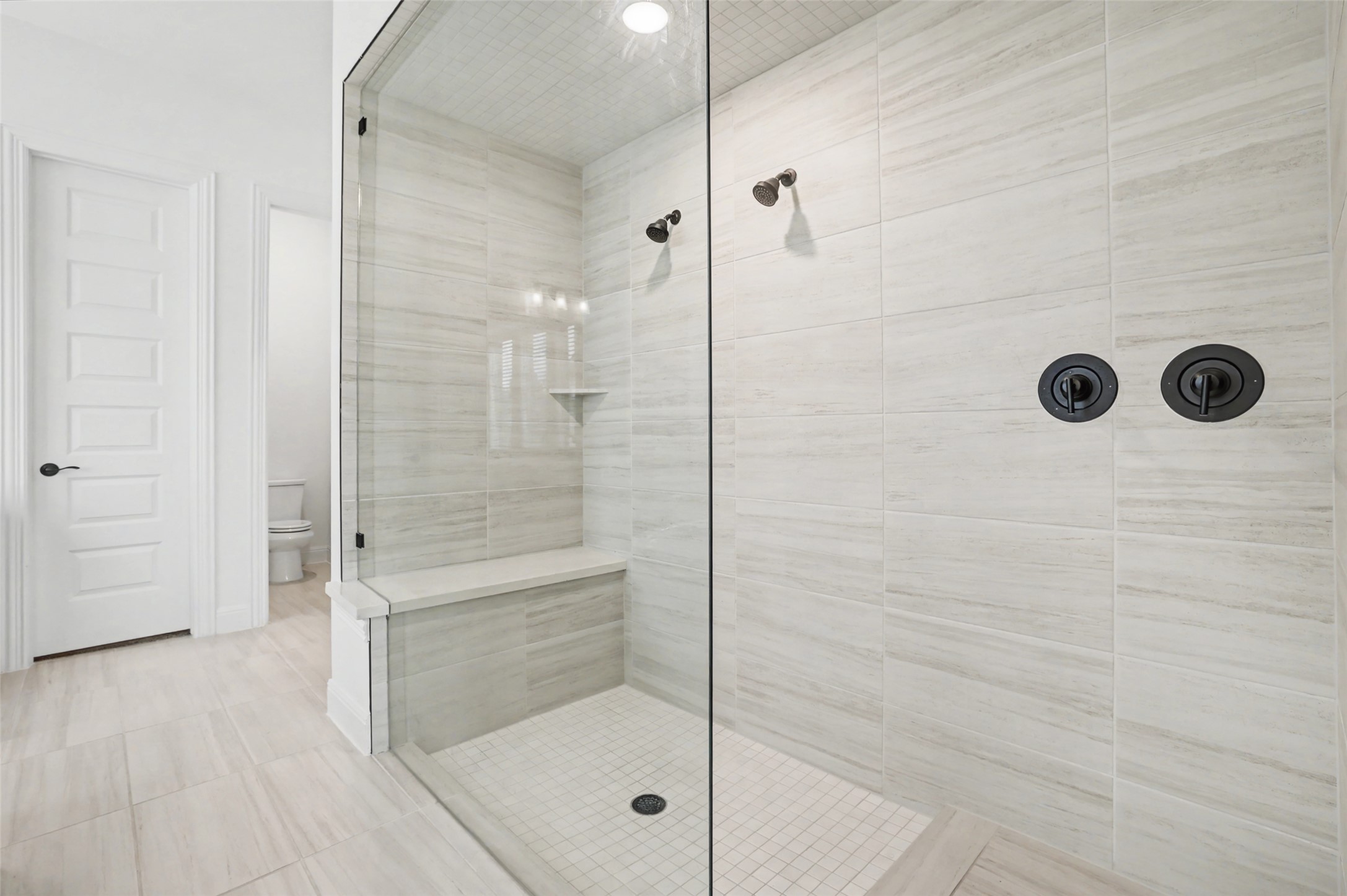 104 Rocky River Road Georgetown, TX 78628 - Photo 20 of 39 a bathroom with a glass shower door