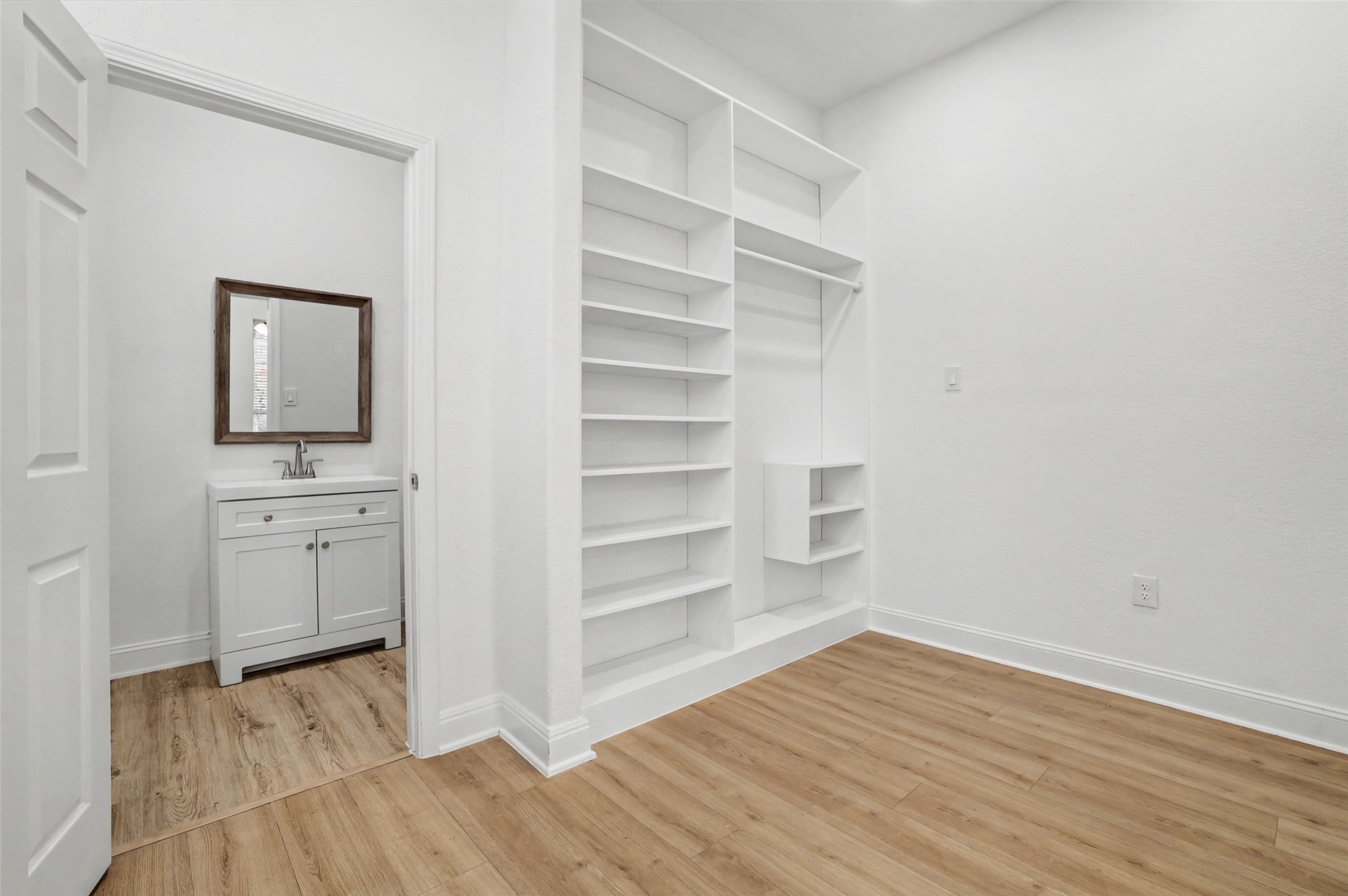104 Rocky River Road Georgetown, TX 78628 - Photo 28 of 39 a view of a room with wooden floor and cabinet