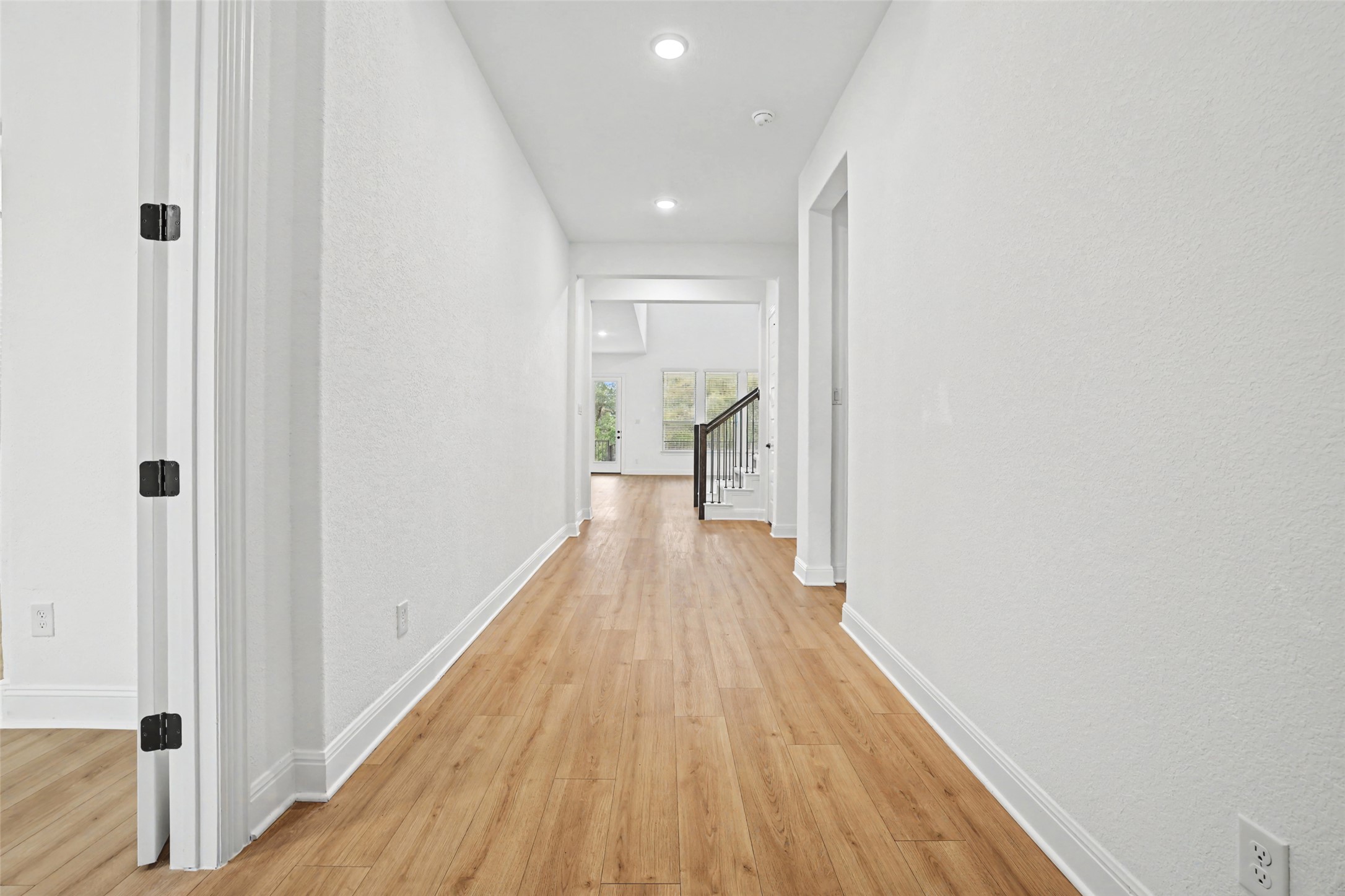 104 Rocky River Road Georgetown, TX 78628 - Photo 3 of 39 a view of a hallway with wooden floor and staircase