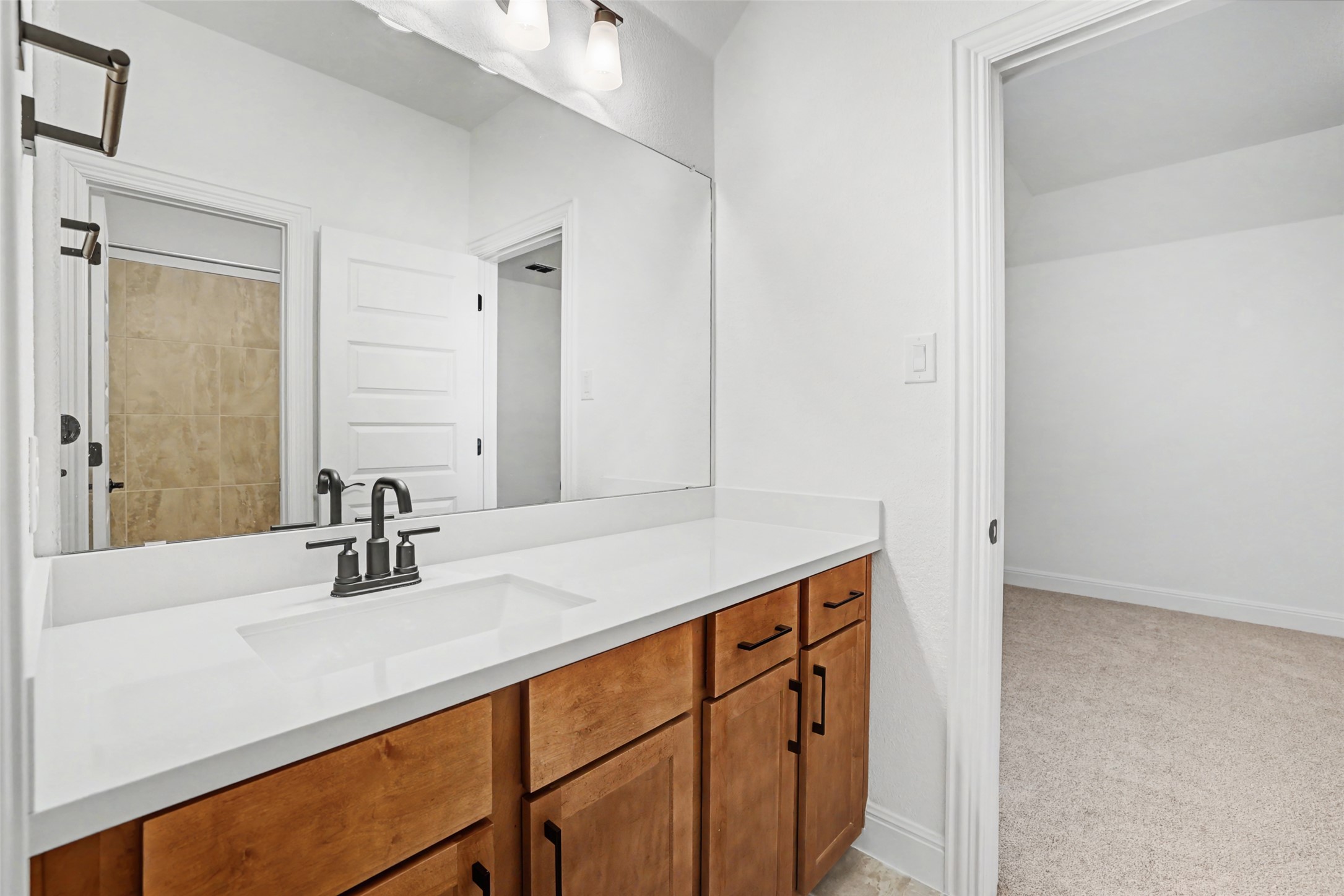 104 Rocky River Road Georgetown, TX 78628 - Photo 31 of 39 a bathroom with a sink and a mirror