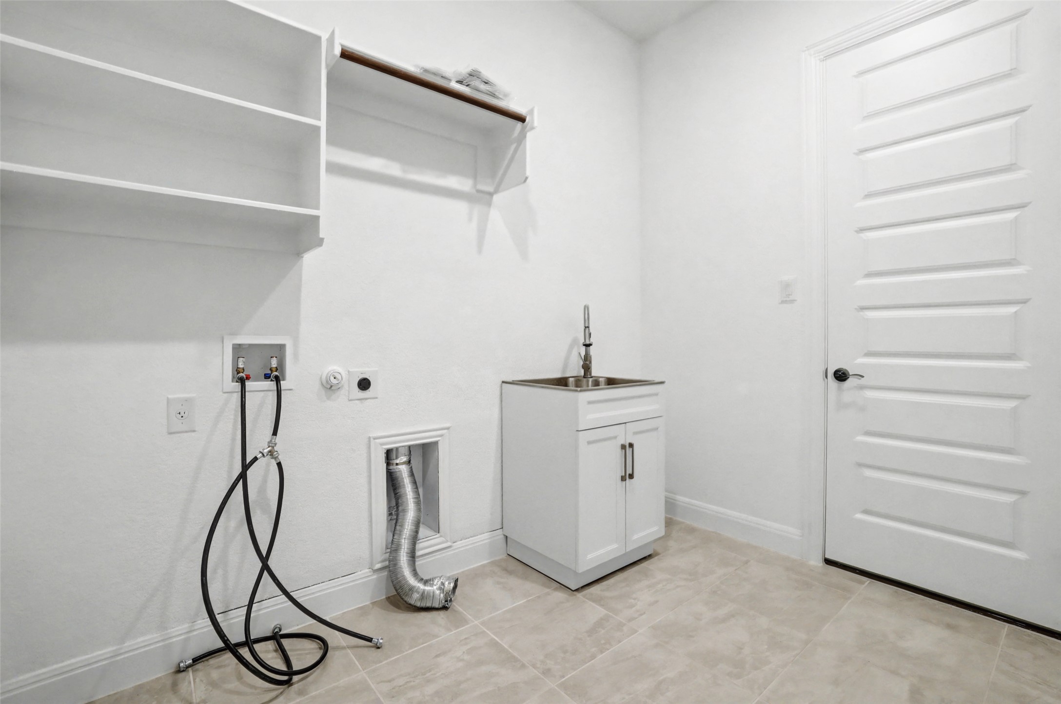 104 Rocky River Road Georgetown, TX 78628 - Photo 32 of 39 a room with white cabinets and white walls