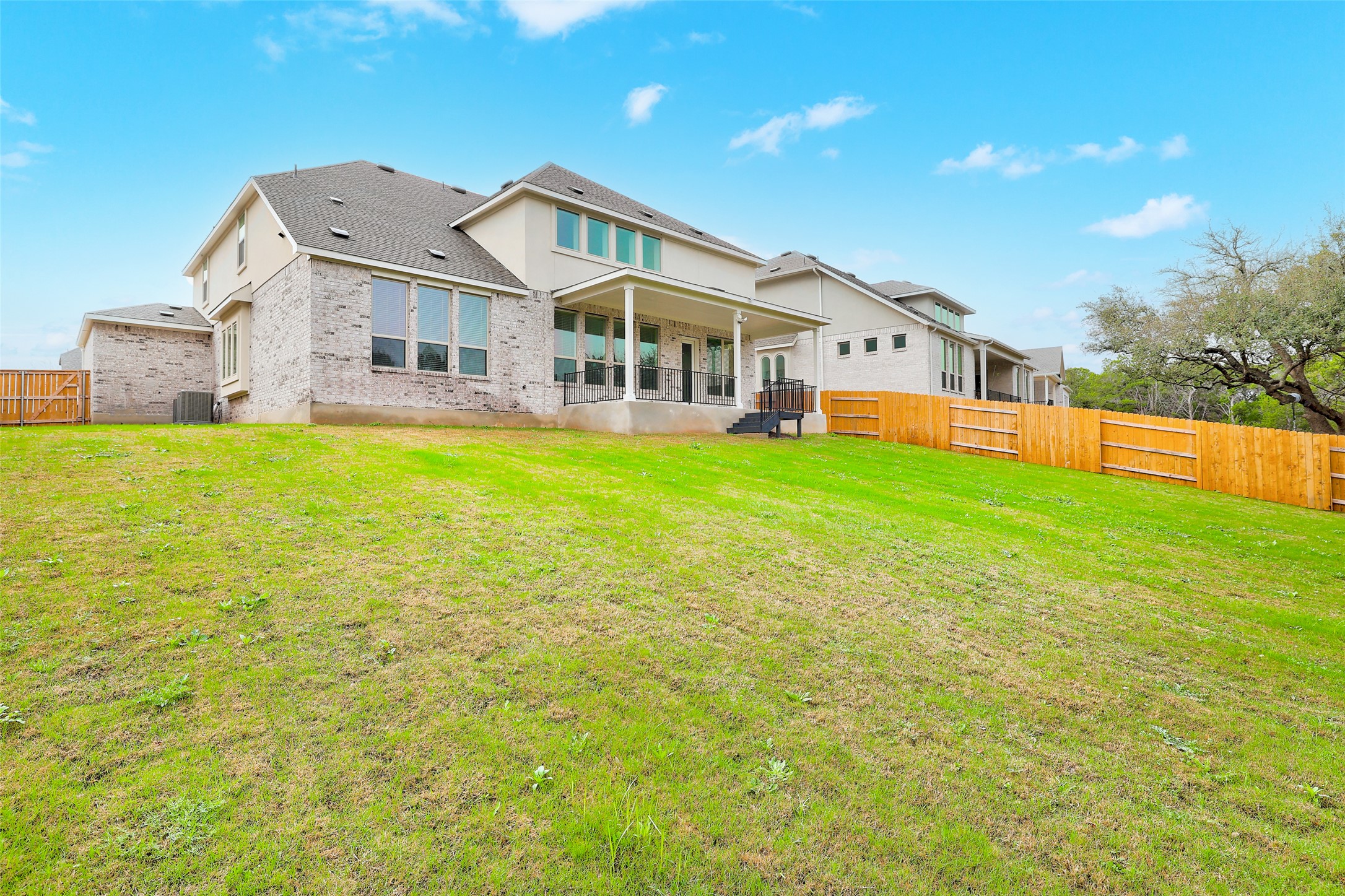 104 Rocky River Road Georgetown, TX 78628 - Photo 36 of 39 a front view of a house with a big yard and large trees