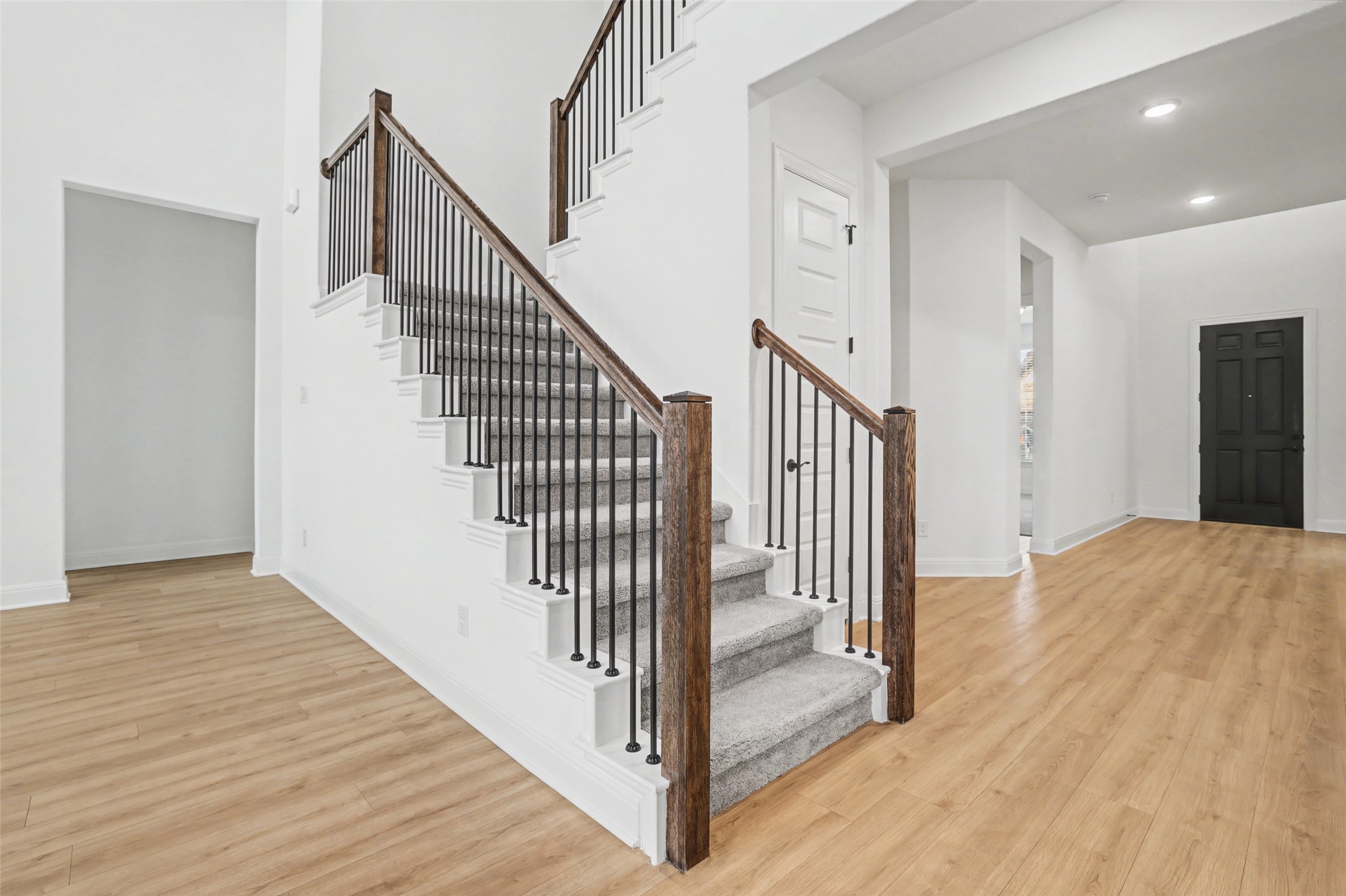 104 Rocky River Road Georgetown, TX 78628 - Photo 5 of 39 a view of a hallway with wooden floor and staircase