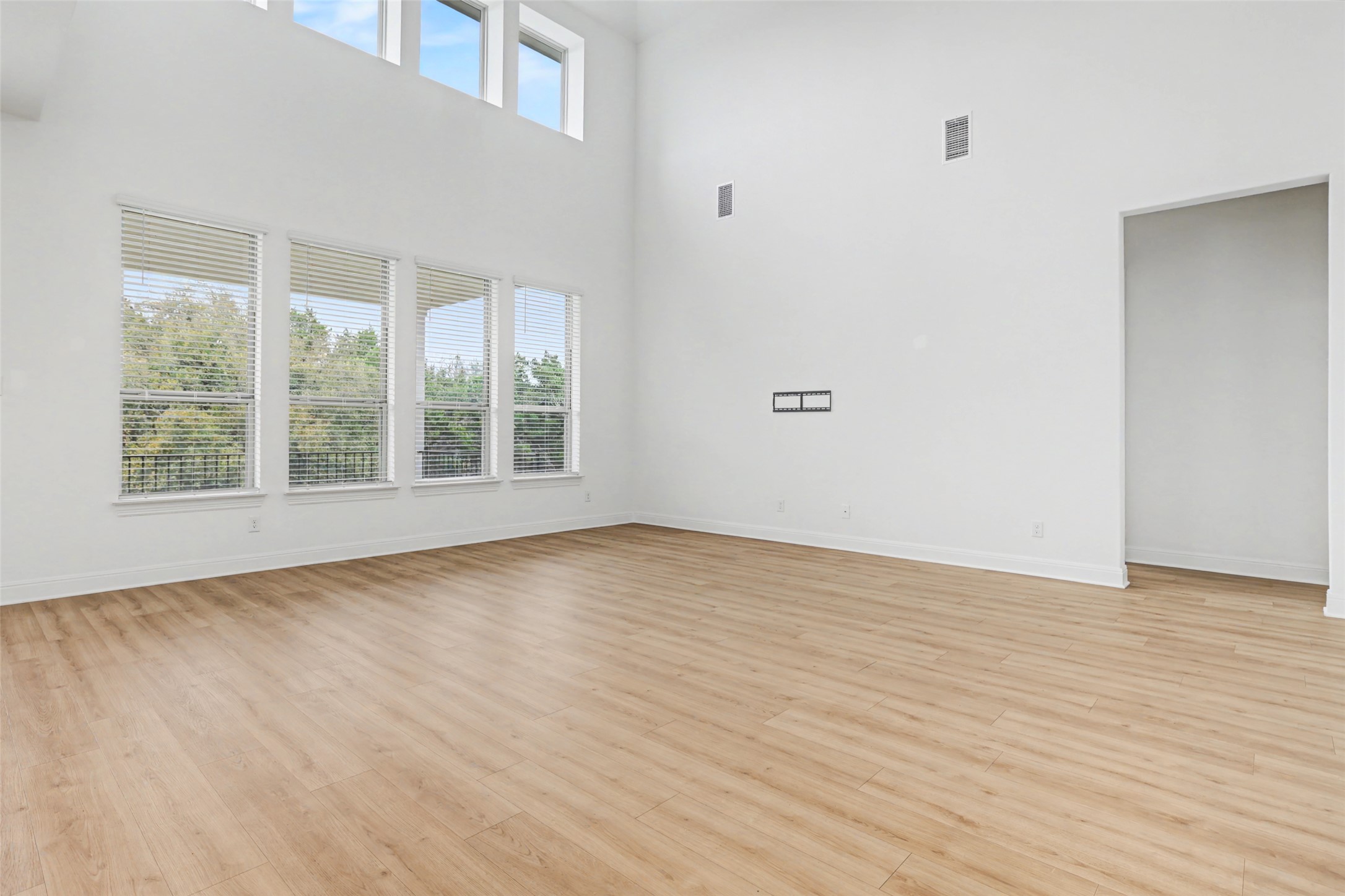 104 Rocky River Road Georgetown, TX 78628 - Photo 7 of 39 wooden floor in an empty room with a window