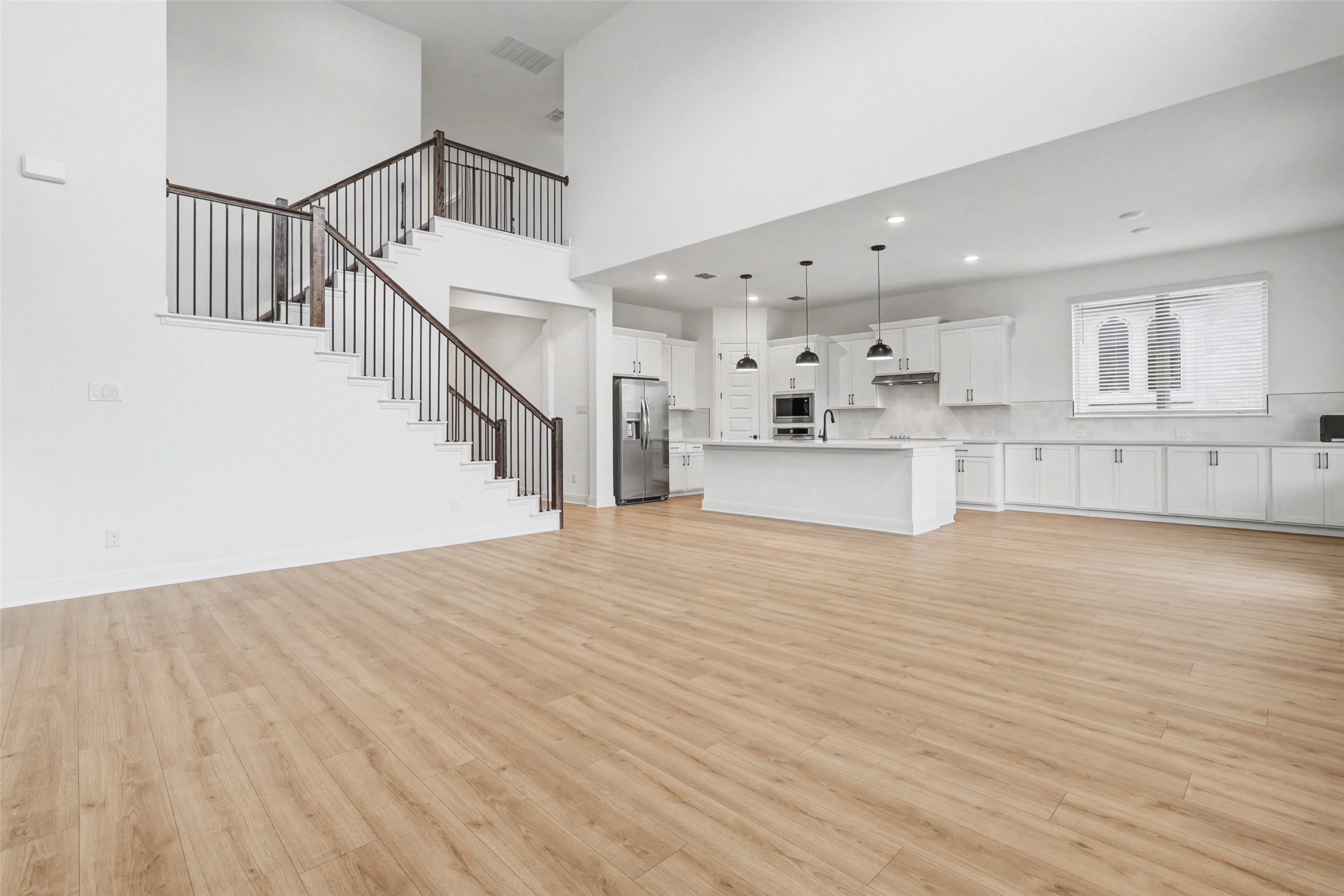 104 Rocky River Road Georgetown, TX 78628 - Photo 9 of 39 a view of kitchen with cabinets and wooden floor