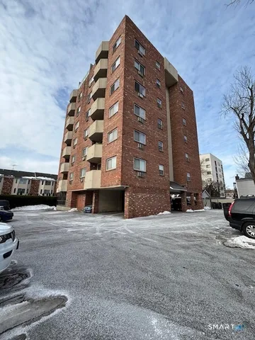 a view of a house with pool and sitting area