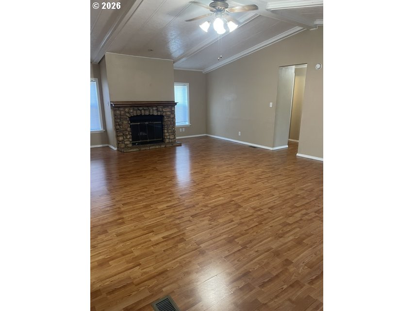 5660 Daisy Street, Unit 31 Springfield, OR 97478 - Photo 37 of 44 a view of a livingroom with wooden floor and a fireplace