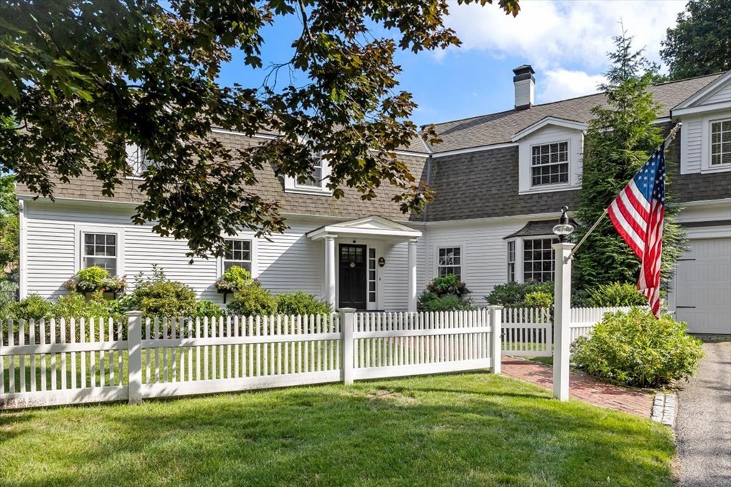 241 Jerusalem Road Cohasset, MA 02025 - Photo 1 of 42 a front view of a house with a garden and plants