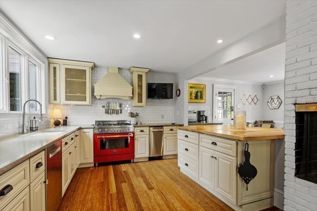 241 Jerusalem Road Cohasset, MA 02025 - Photo 12 of 42 a kitchen with stainless steel appliances granite countertop a stove sink and cabinets