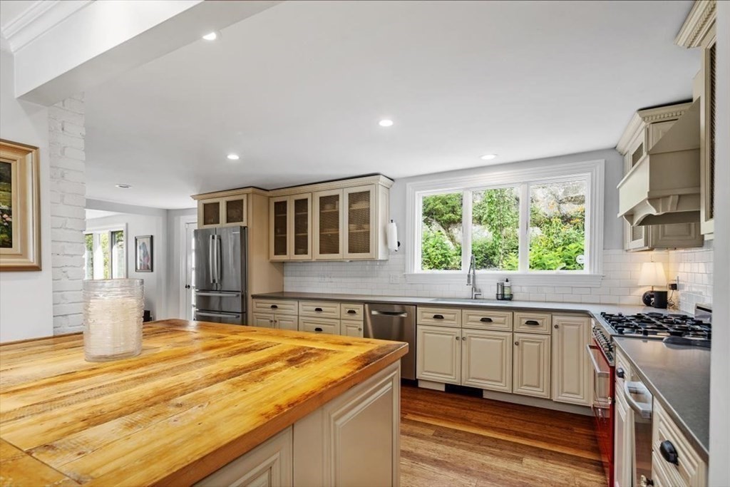 241 Jerusalem Road Cohasset, MA 02025 - Photo 14 of 42 a kitchen with stainless steel appliances granite countertop a sink and cabinets