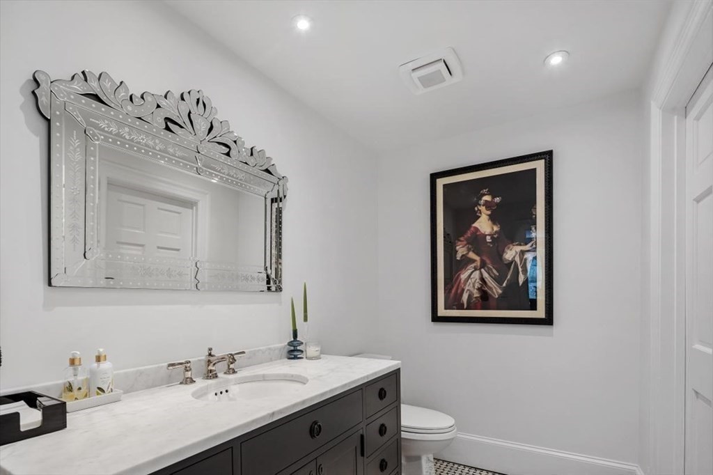 241 Jerusalem Road Cohasset, MA 02025 - Photo 17 of 42 a bathroom with a toilet sink mirror and vanity