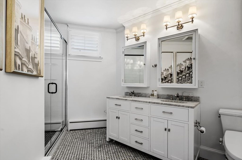 241 Jerusalem Road Cohasset, MA 02025 - Photo 25 of 42 a bathroom with a granite countertop sink a mirror a vanity and a shower