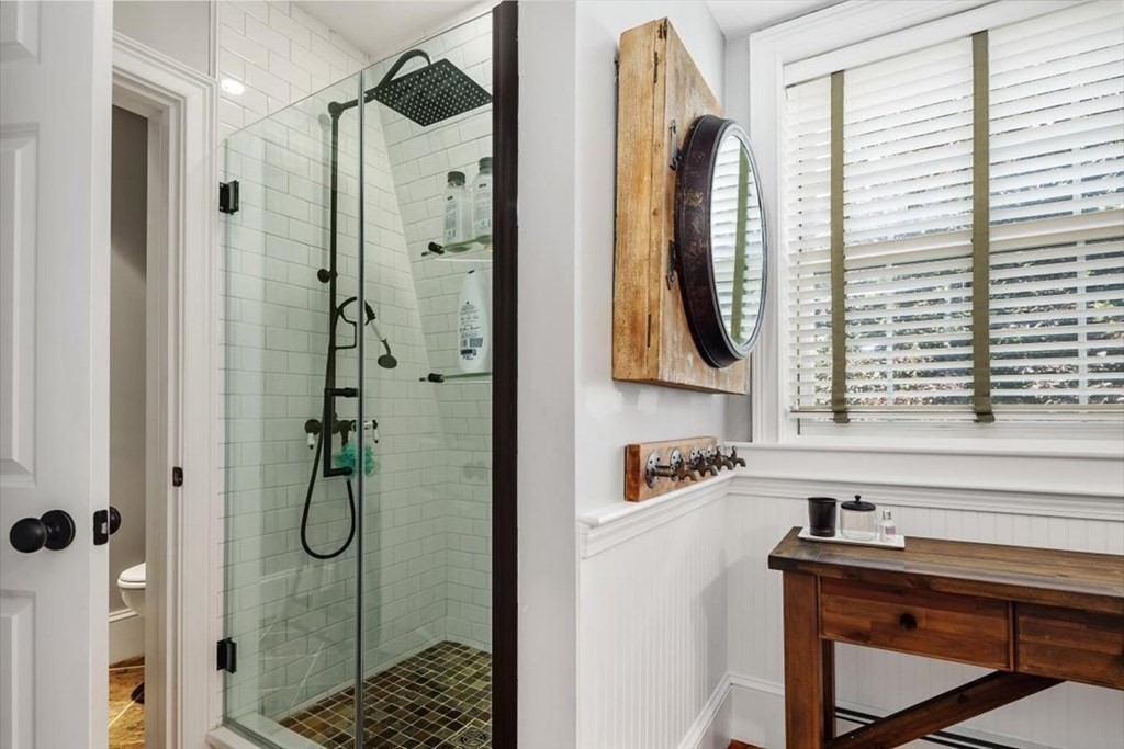 241 Jerusalem Road Cohasset, MA 02025 - Photo 31 of 42 a bathroom with a sink a mirror a window and glass door shower