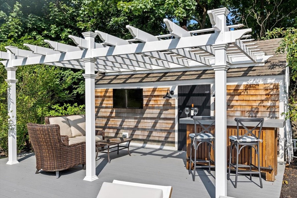 241 Jerusalem Road Cohasset, MA 02025 - Photo 40 of 42 a view of a patio with table and chairs potted plants
