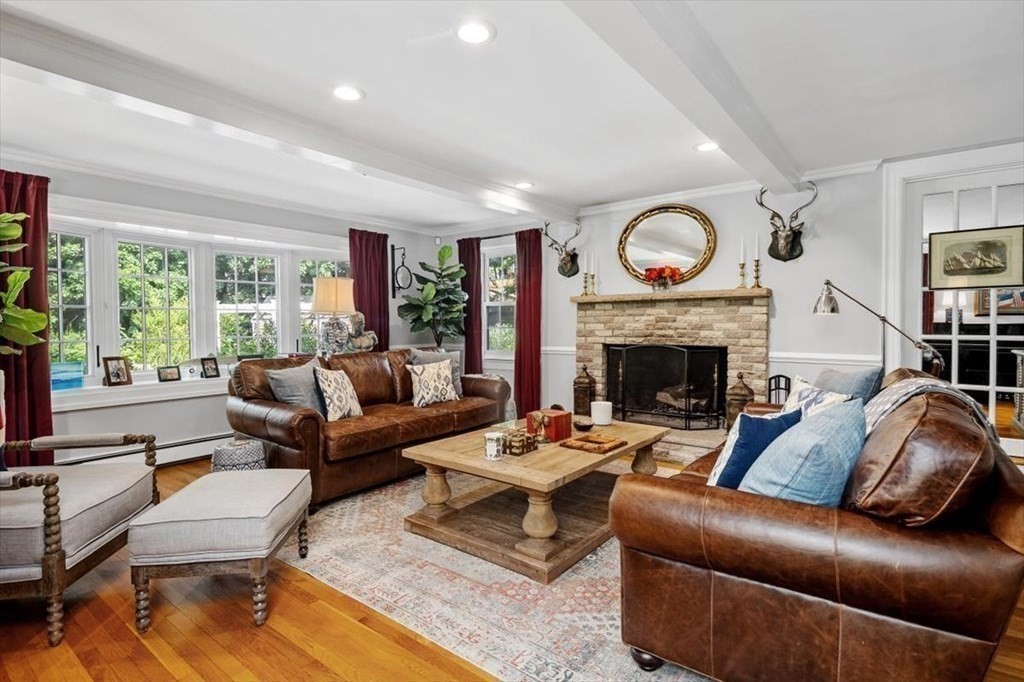 241 Jerusalem Road Cohasset, MA 02025 - Photo 9 of 42 a living room with furniture a large window and a fireplace