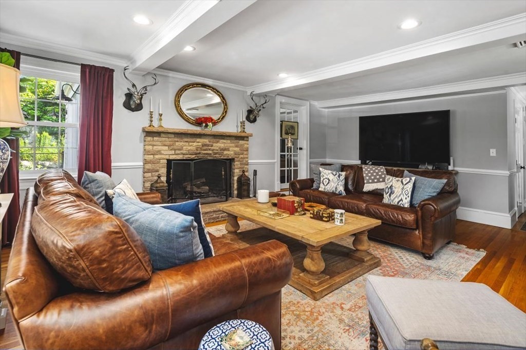 241 Jerusalem Road Cohasset, MA 02025 - Photo 10 of 42 a living room with furniture and a fireplace