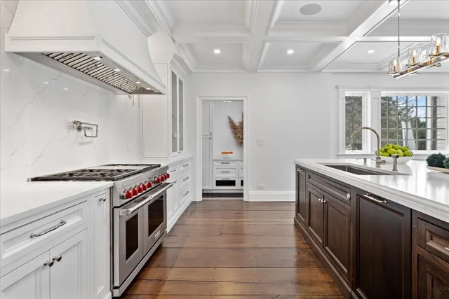 a kitchen with a stove and a sink