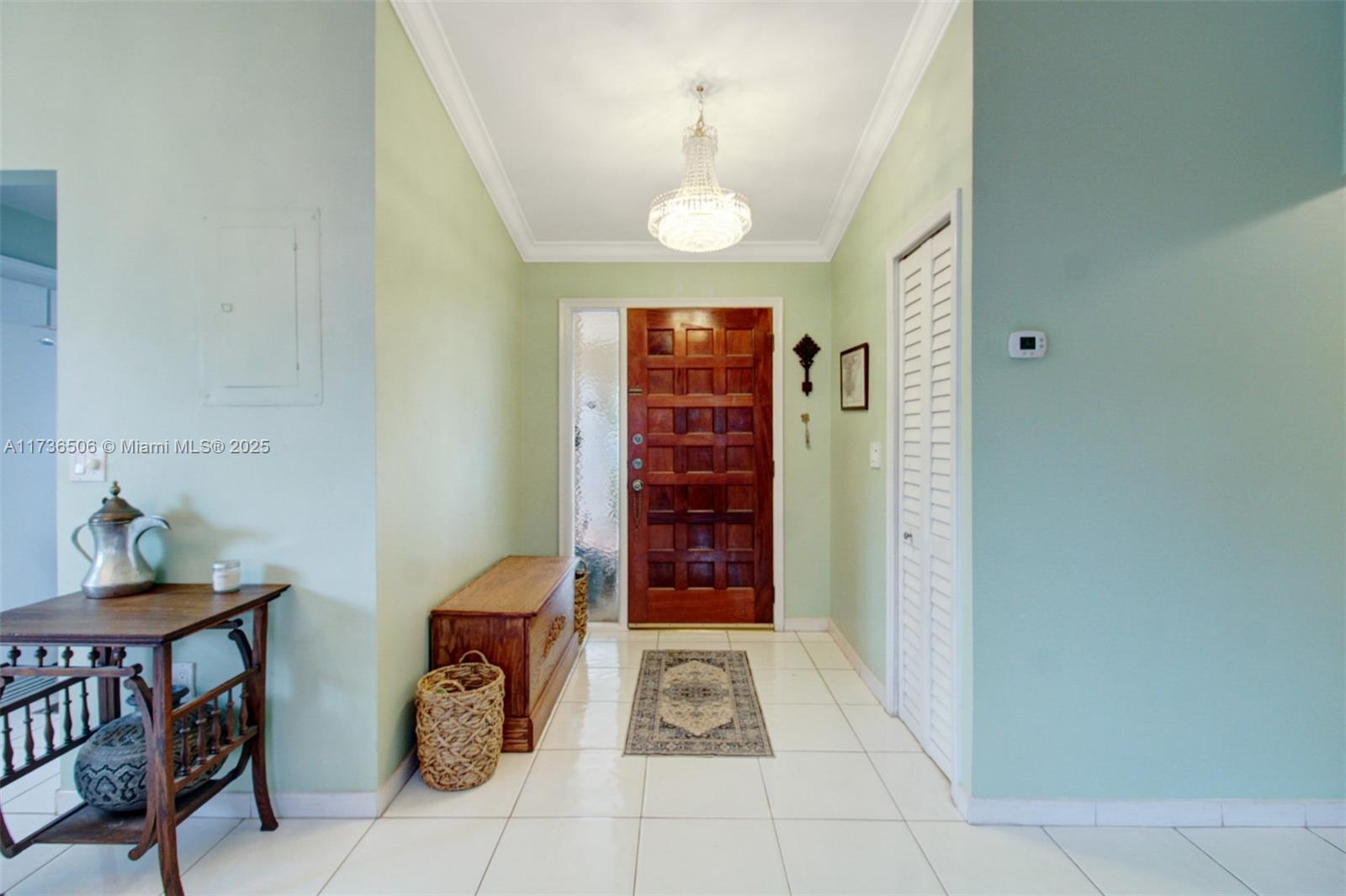6425 Southwest 133rd Place Miami, FL 33183 - Photo 11 of 25 a view of entryway with a grandfather clock and a dresser