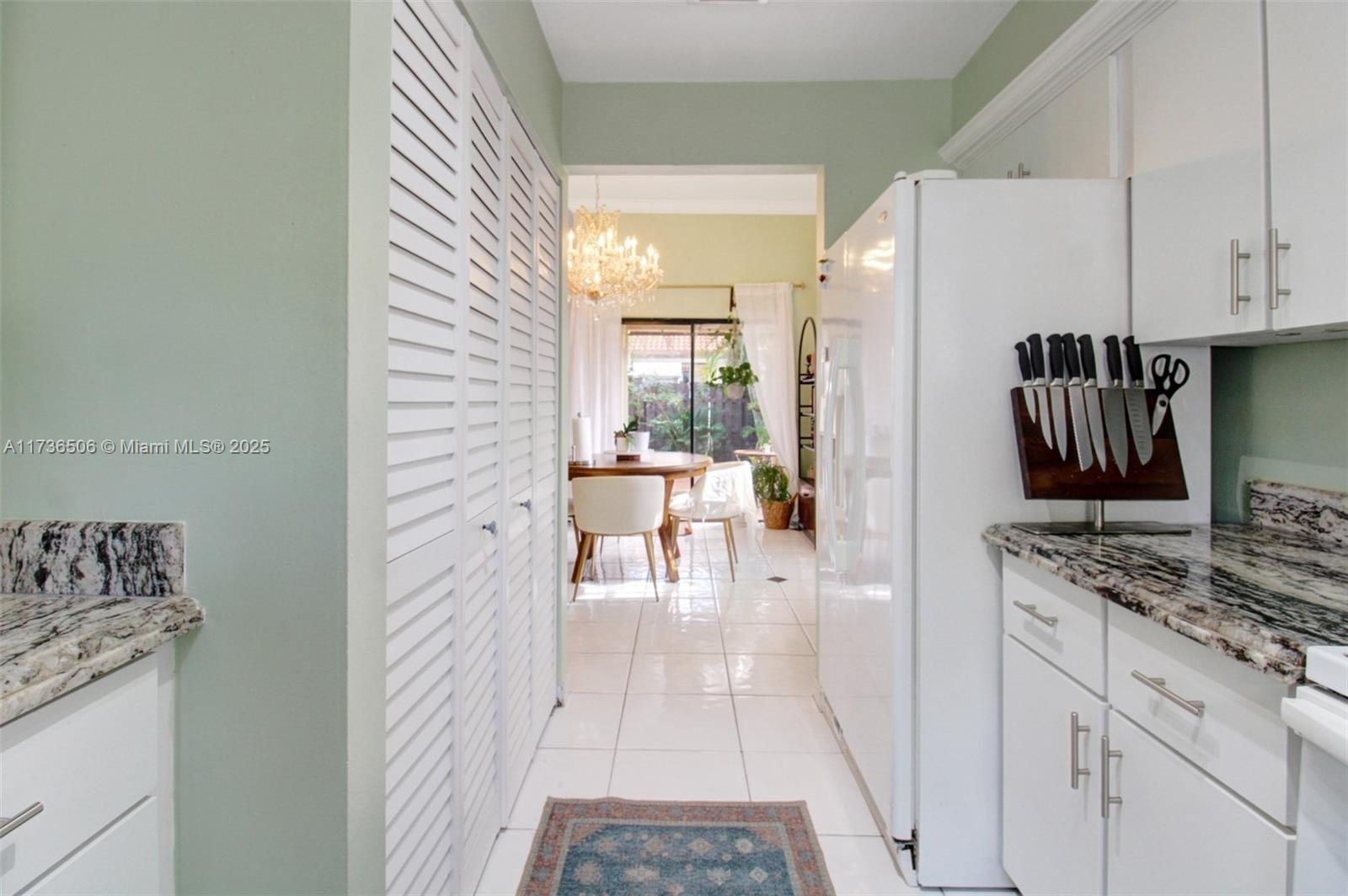 6425 Southwest 133rd Place Miami, FL 33183 - Photo 16 of 25 a kitchen with stainless steel appliances granite countertop a refrigerator and a stove top oven