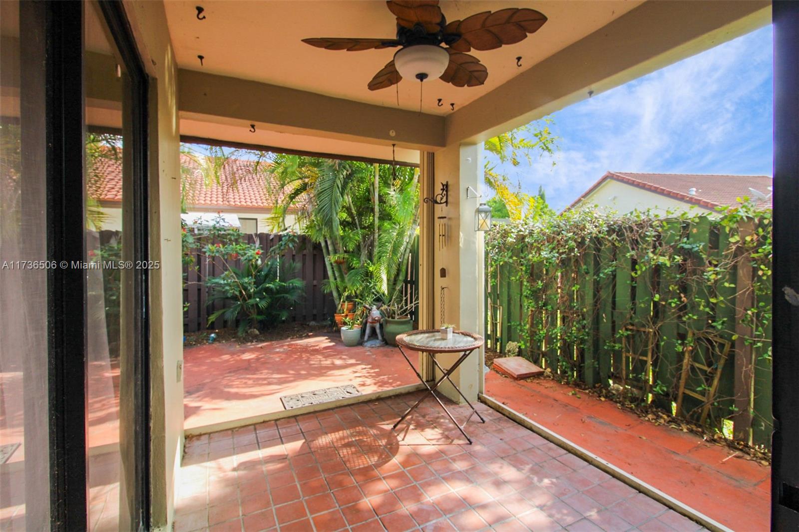 6425 Southwest 133rd Place Miami, FL 33183 - Photo 21 of 25 a view of an empty room with a floor to ceiling window and a yard