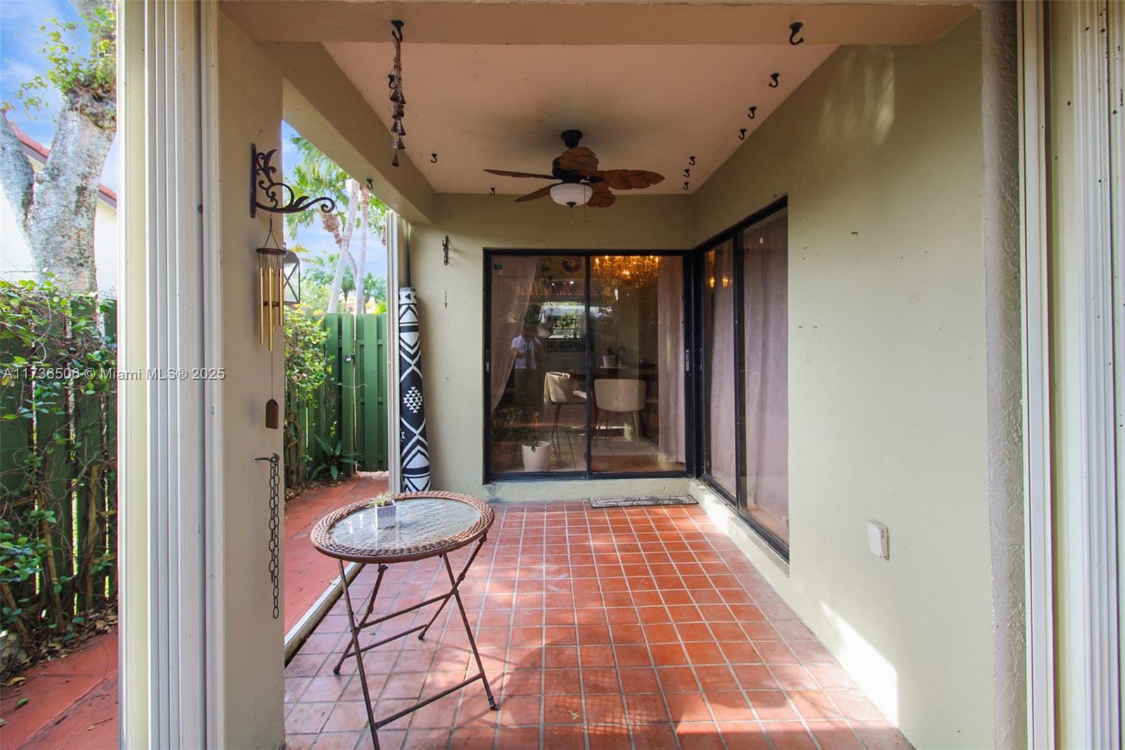 6425 Southwest 133rd Place Miami, FL 33183 - Photo 22 of 25 a view of a porch with a table and chairs
