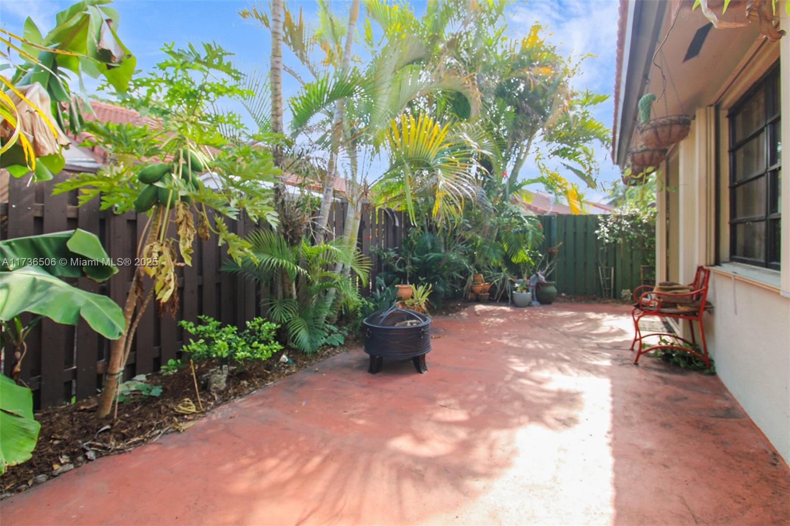 6425 Southwest 133rd Place Miami, FL 33183 - Photo 23 of 25 a view of a backyard with potted plants