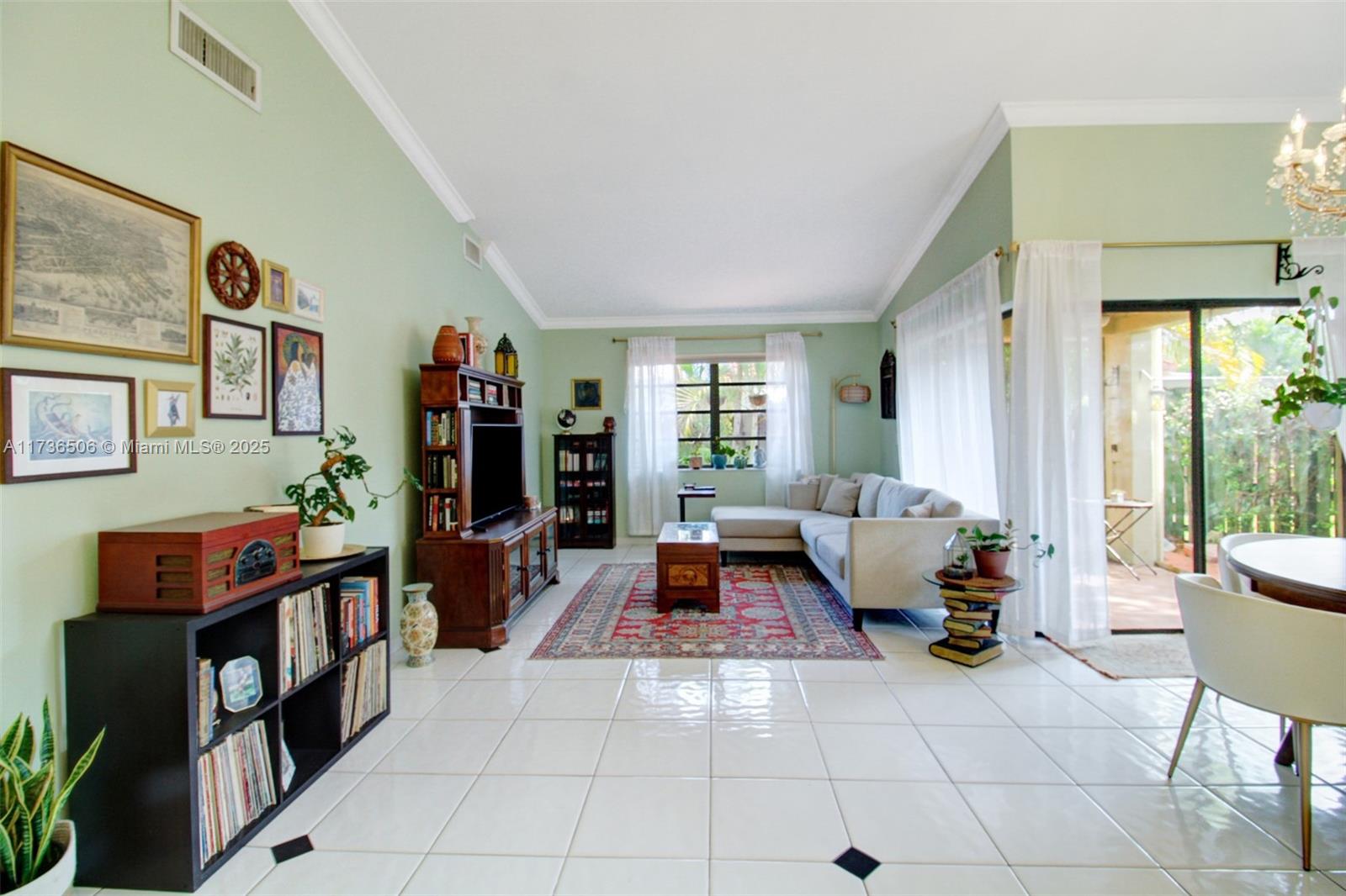 6425 Southwest 133rd Place Miami, FL 33183 - Photo 5 of 25 a living room with furniture and a book shelf
