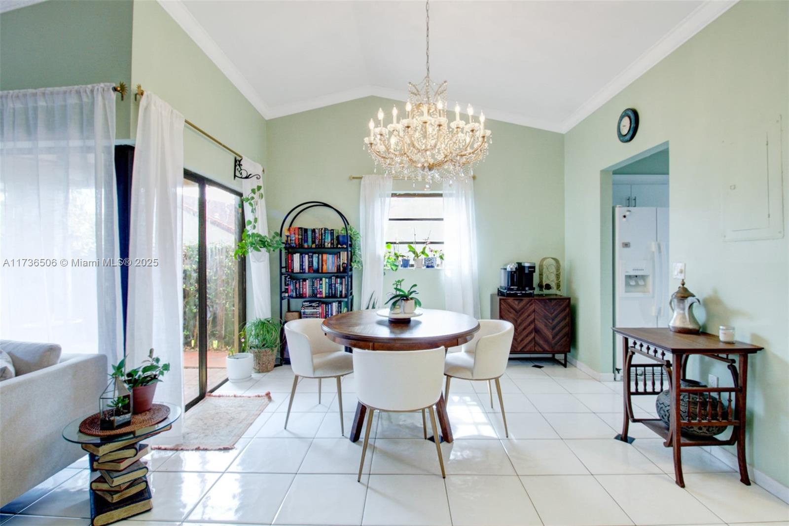 6425 Southwest 133rd Place Miami, FL 33183 - Photo 9 of 25 a view of a dining room with furniture wooden floor and chandelier