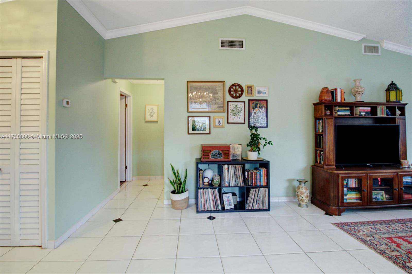 6425 Southwest 133rd Place Miami, FL 33183 - Photo 10 of 25 a living room with furniture and a flat screen tv