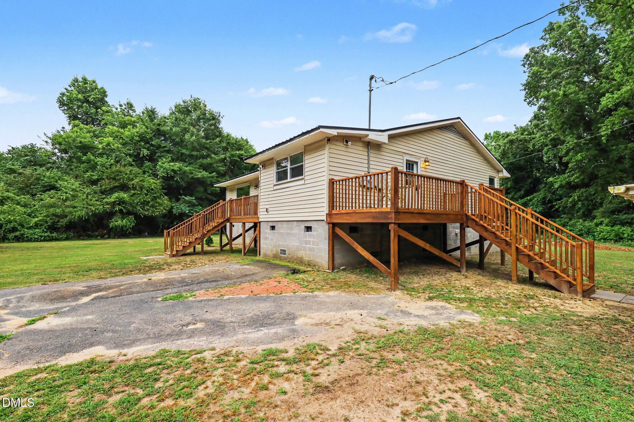 977 Stevens Mill Road Goldsboro, NC 27530 - Photo 3 of 31 a view of a house with a yard