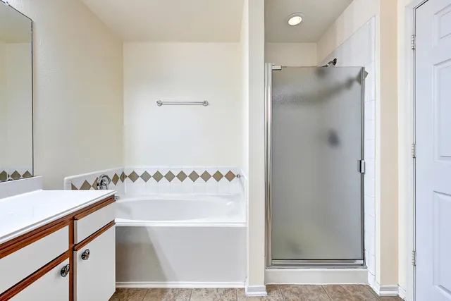 a bathroom with a tub and a sink