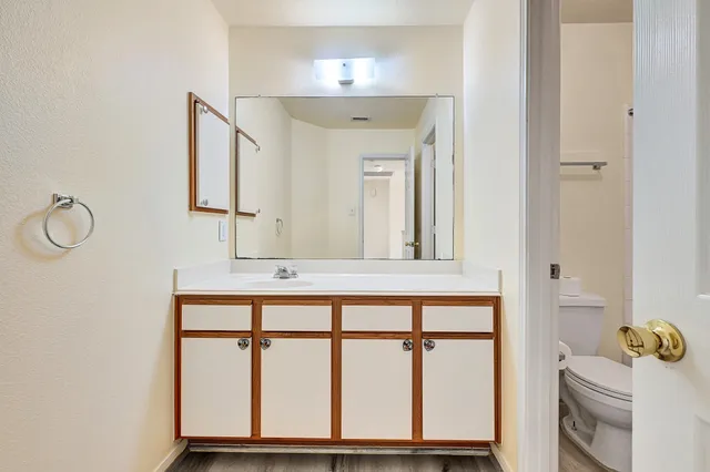 a bathroom with a sink a mirror and a window