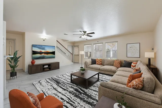a living room with furniture and a flat screen tv