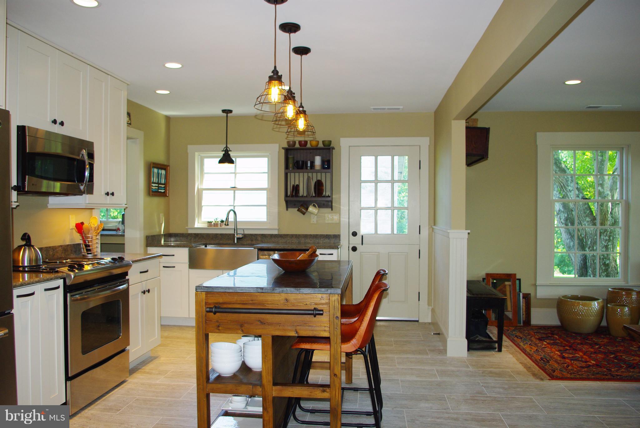 3699 Slate Mills Road Sperryville, VA 22740 - Photo 3 of 21 Open kitchen and dinging area