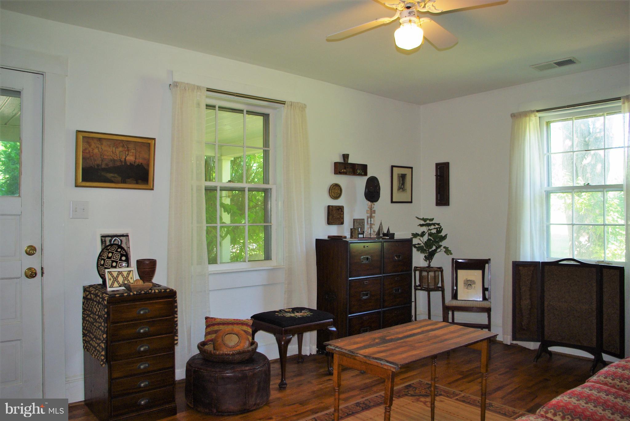 3699 Slate Mills Road Sperryville, VA 22740 - Photo 10 of 21 The living room opens out to the front porch