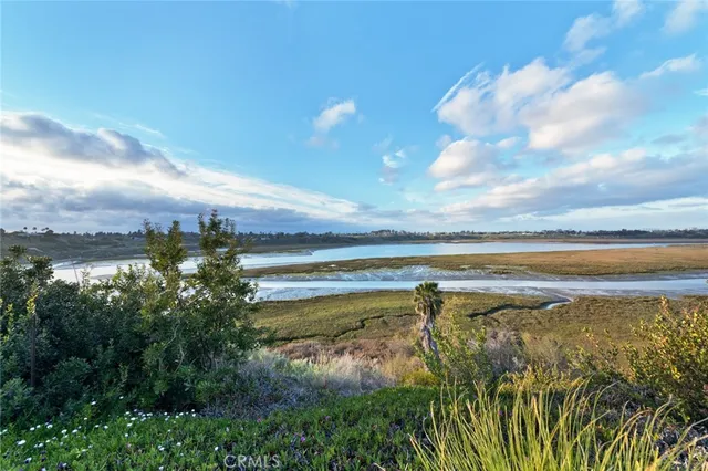 a living room with furniture a table and wooden floor