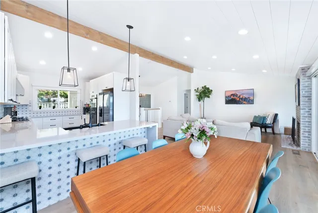 a bathroom with a bathtub and chandelier
