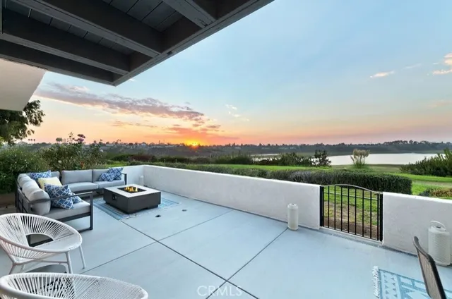 a view of terrace with couches and city view