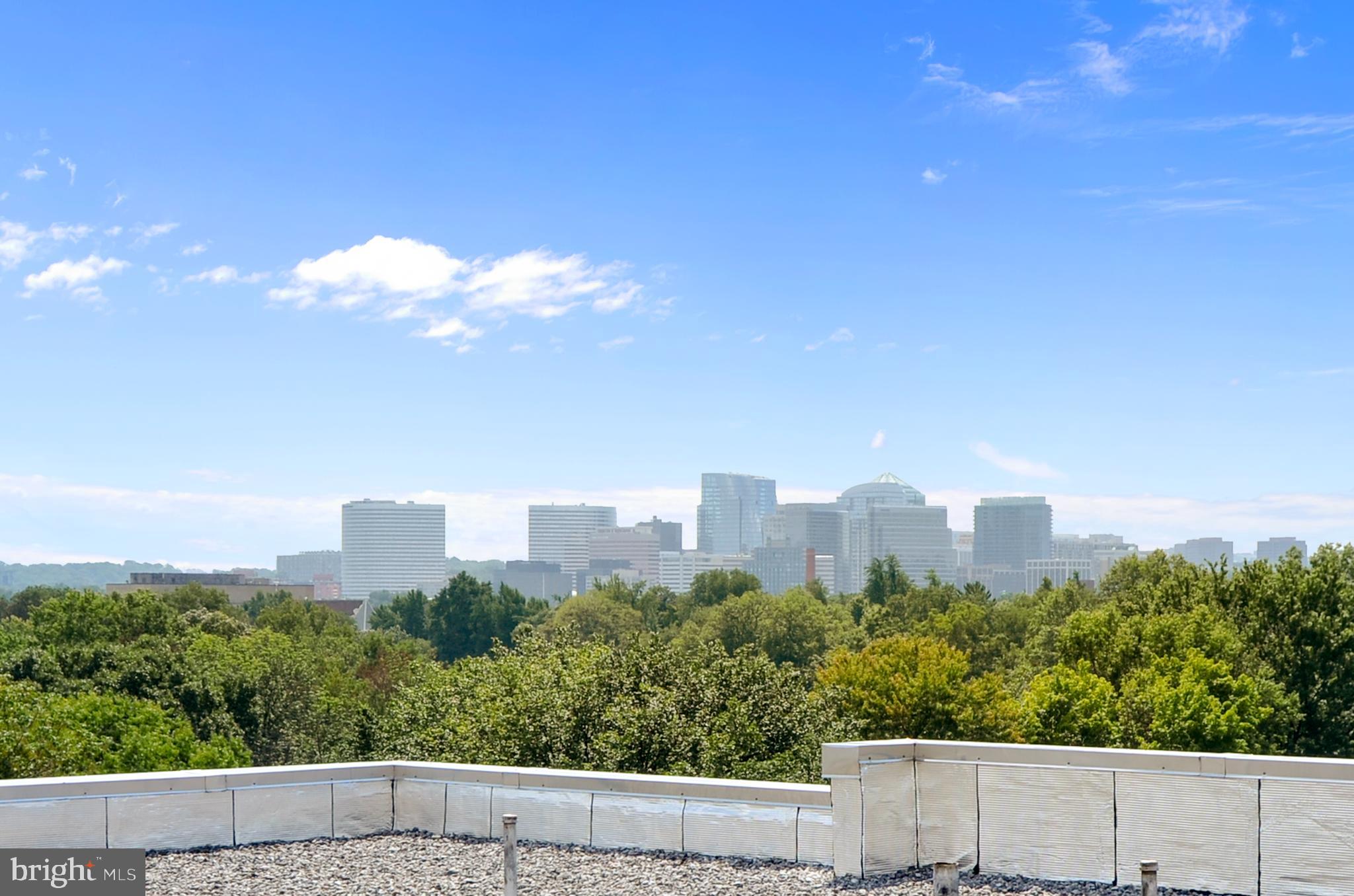 2500 Q Street Northwest, Unit 201 Washington, DC 20007 - Photo 11 of 36 a view of a city with tall buildings in the background