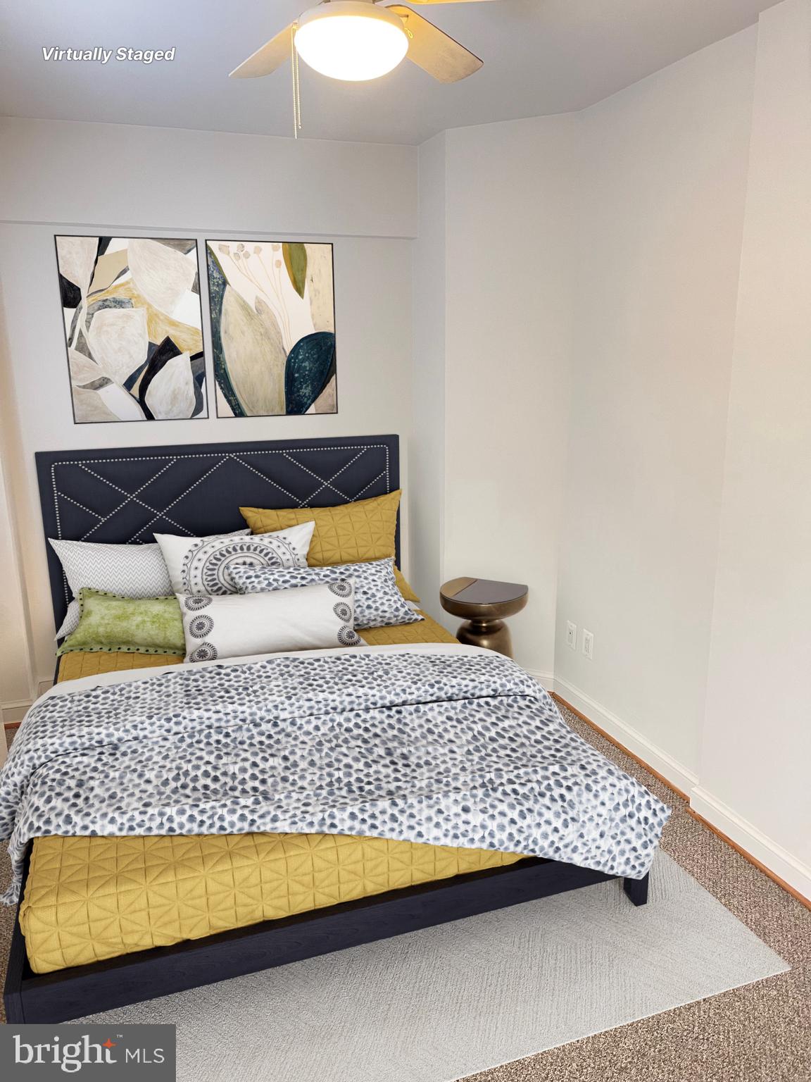 2500 Q Street Northwest, Unit 201 Washington, DC 20007 - Photo 27 of 36 a bedroom with a bed and painting on the wall