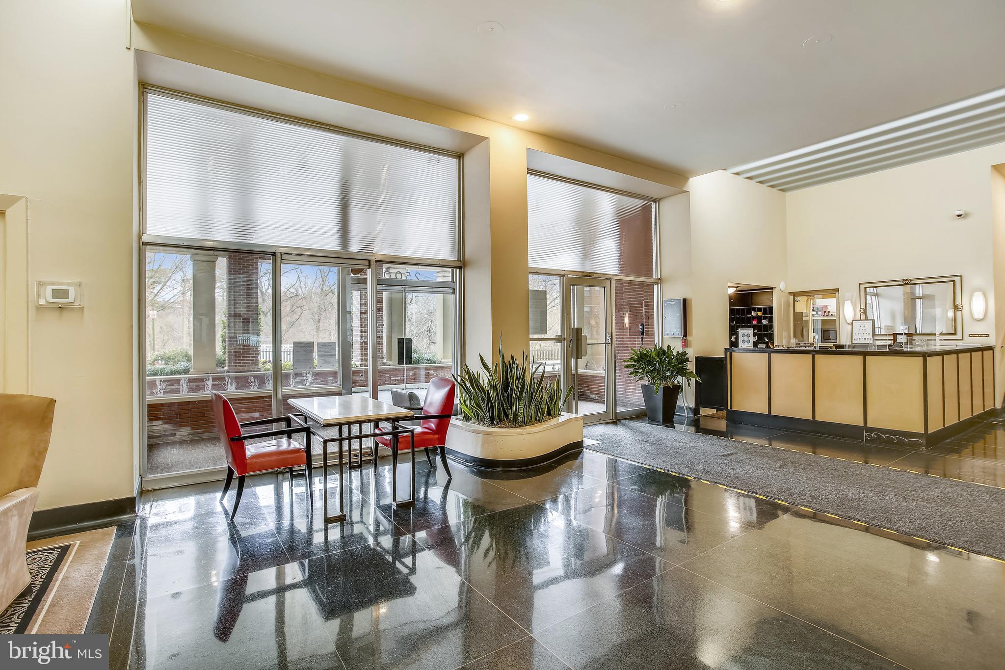 2500 Q Street Northwest, Unit 201 Washington, DC 20007 - Photo 6 of 36 a living room with furniture and floor to ceiling windows