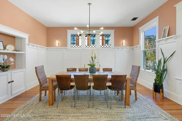 a kitchen with stainless steel appliances a sink a stove and a window