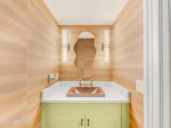 a large kitchen with stainless steel appliances a lot of counter space and a large window