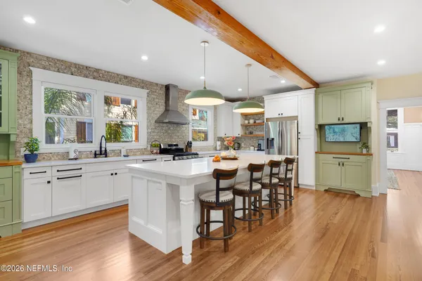 a view of a dining room with furniture and wooden floor