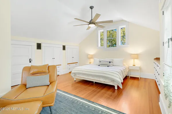 a bedroom with a bed and a couch