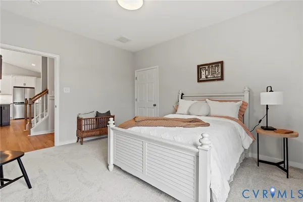 a bedroom with a bed and a table