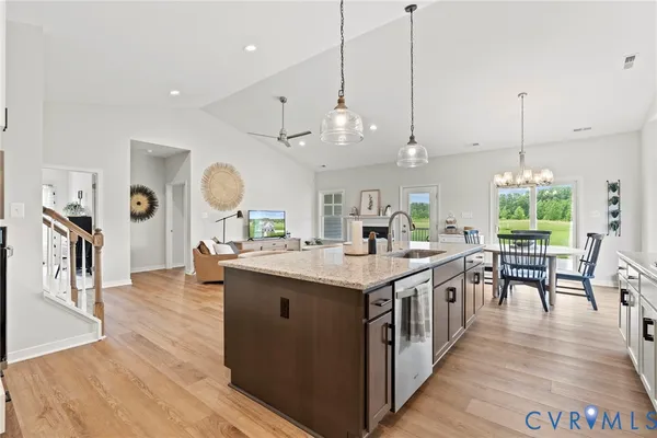 a kitchen with stainless steel appliances granite countertop a stove and cabinets