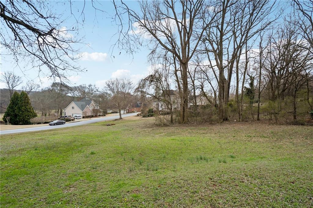 693 Reece Drive Hoschton, GA 30548 - Photo 5 of 16 a view of large trees with a yard