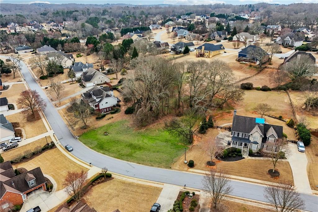 693 Reece Drive Hoschton, GA 30548 - Photo 7 of 16 an aerial view of a house with a yard